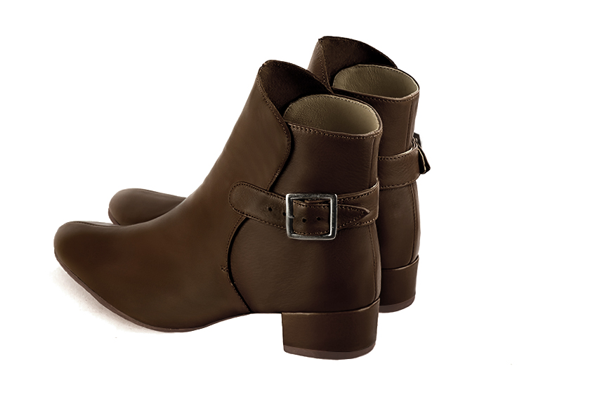Dark brown women's ankle boots with buckles at the back. Round toe. Low block heels. Rear view - Florence KOOIJMAN